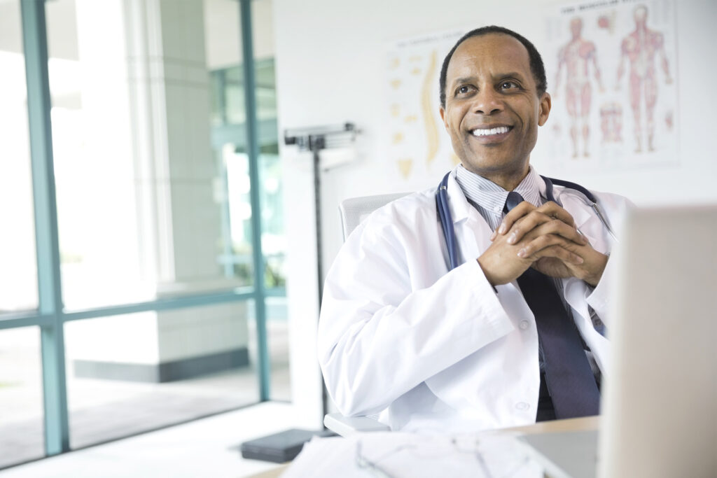 Portrait of confident male doctor smiling